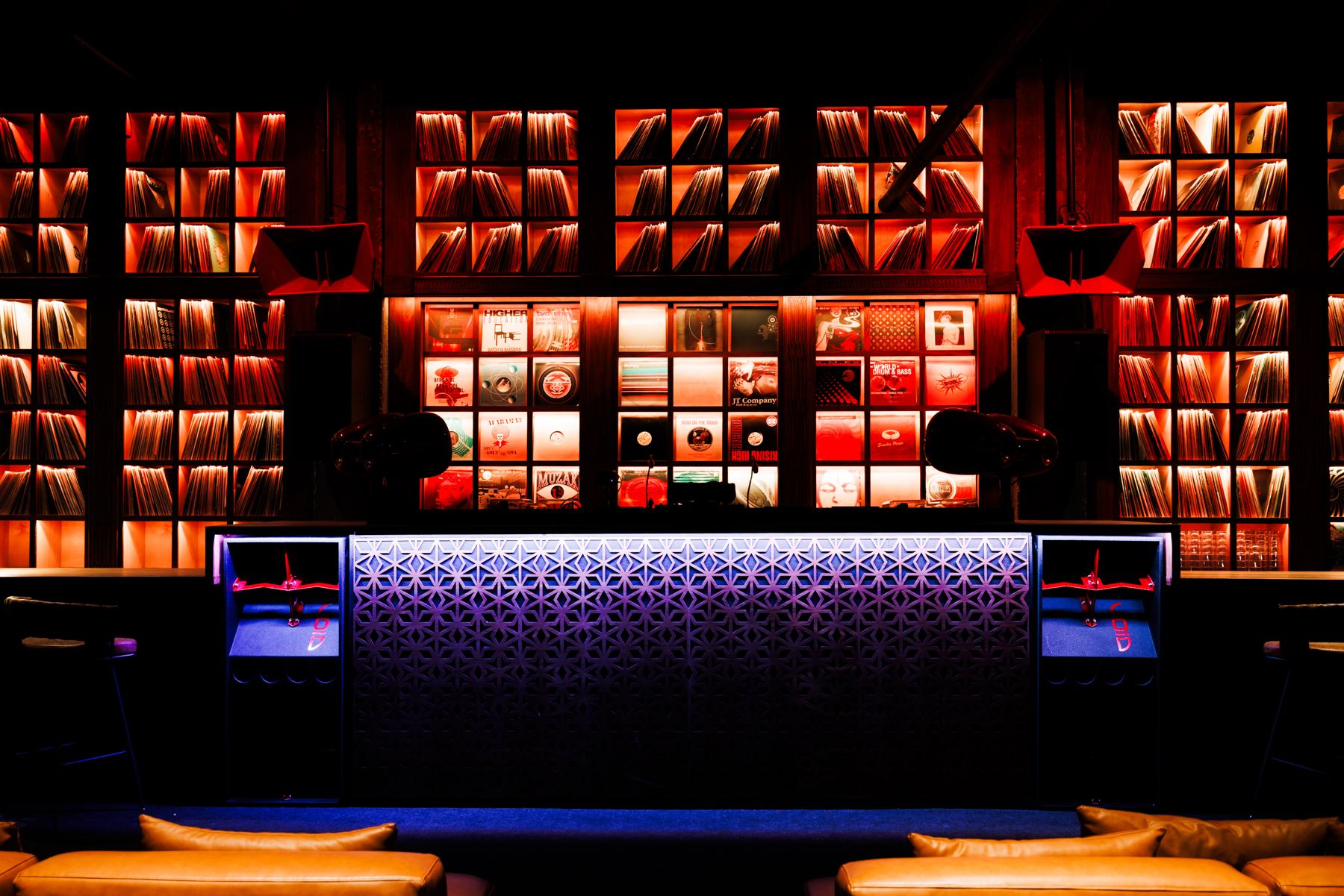 The HiFi Room: the record wall lit above the bar